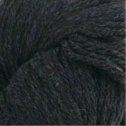 Dark gray skein of yarn with a label on a white background