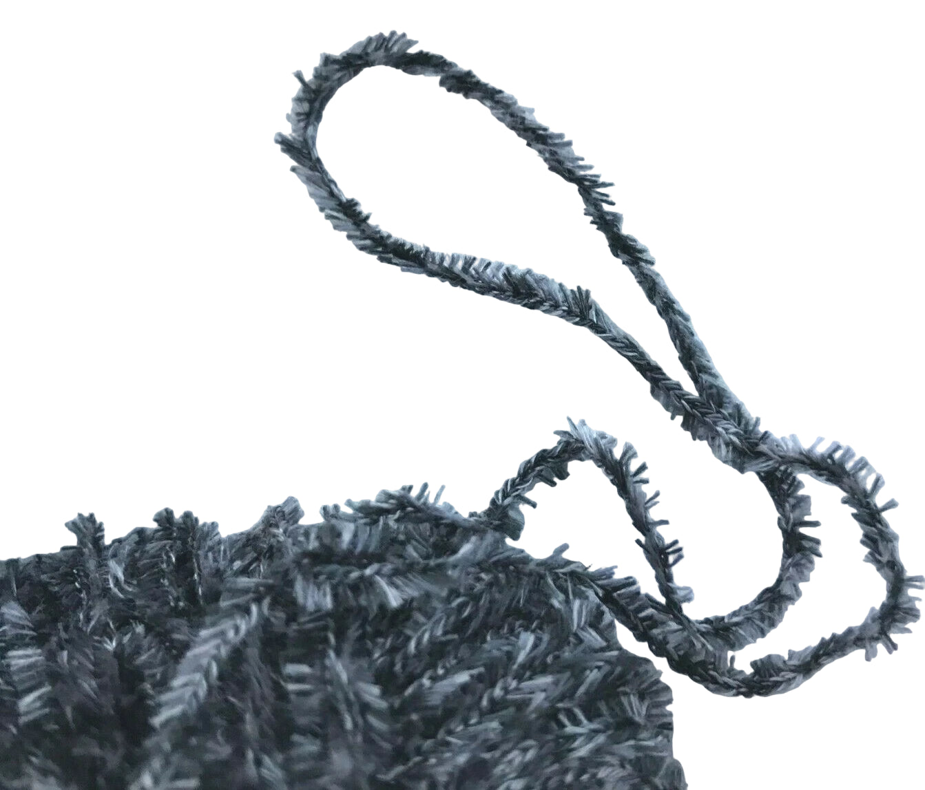 Close-up of a textured black fabric with a loop on a white background