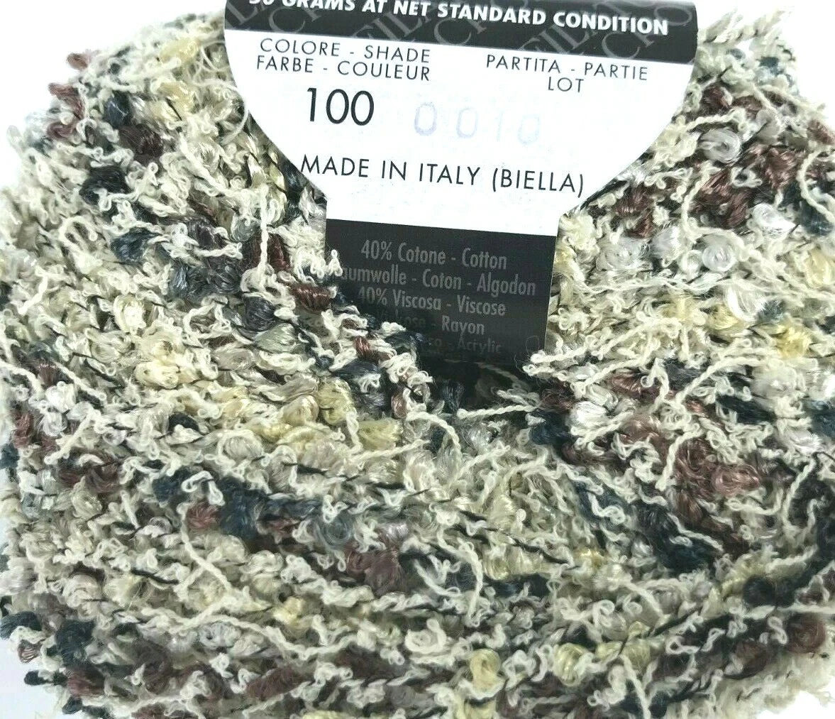 Multicolored yarn ball with labels indicating 'Made in Italy' and fiber composition.