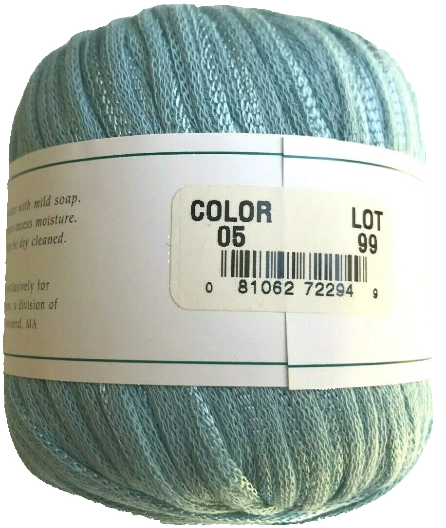 Ball of yarn with a label showing color and lot number on a white background