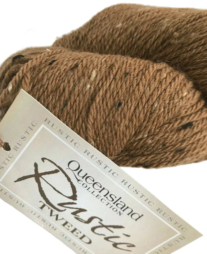 Brown yarn skein with a label on a white background
