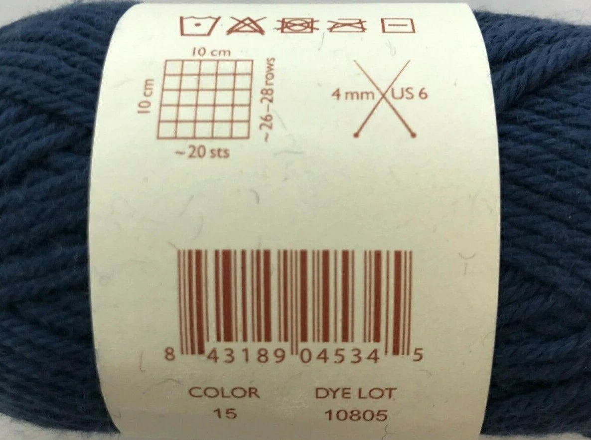 Navy blue yarn with a label showing knitting information and barcode