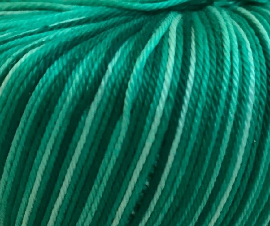 Close-up of teal yarn with a slight gradient