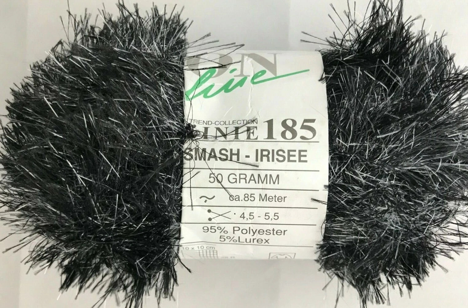 Black yarn ball with a label on a white background