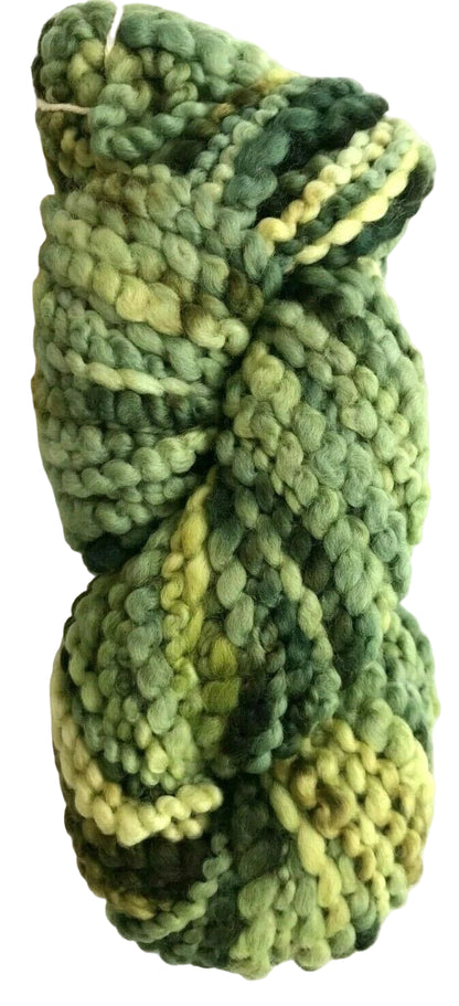 Green skein of yarn on a white background