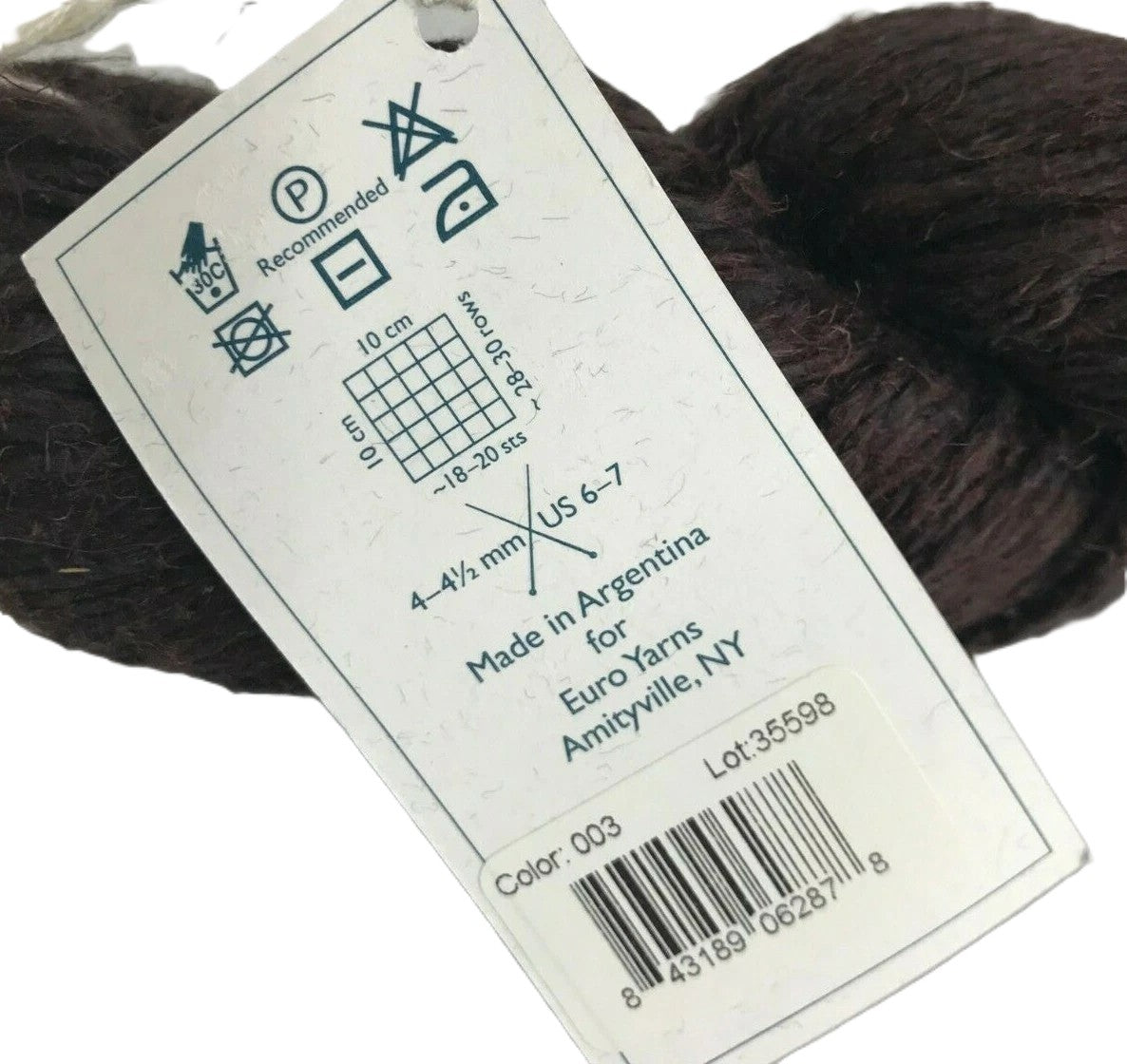 Yarn label with care instructions and product details on a white background