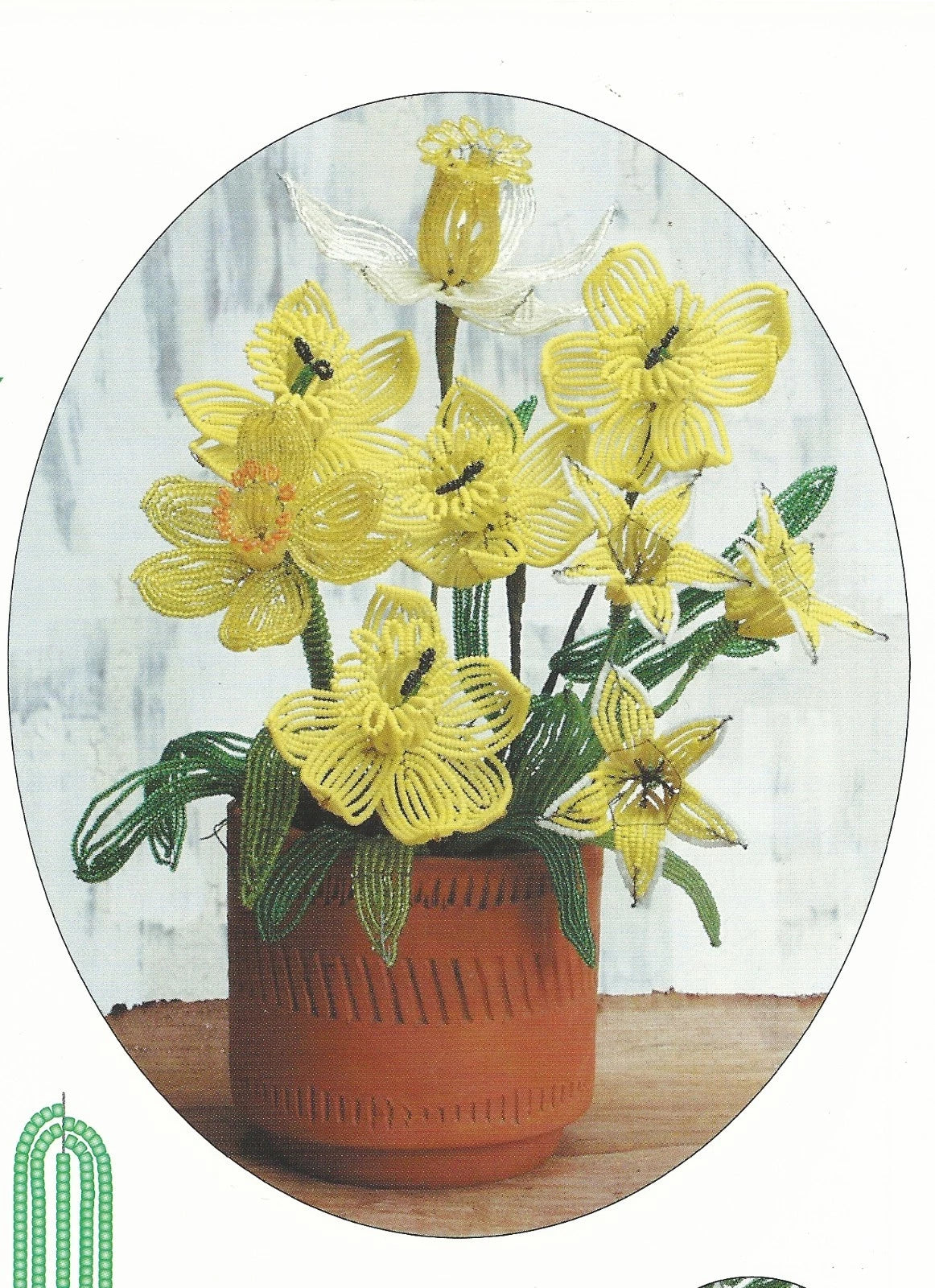 Decorative plate with a design of yellow flowers in a pot on a white background