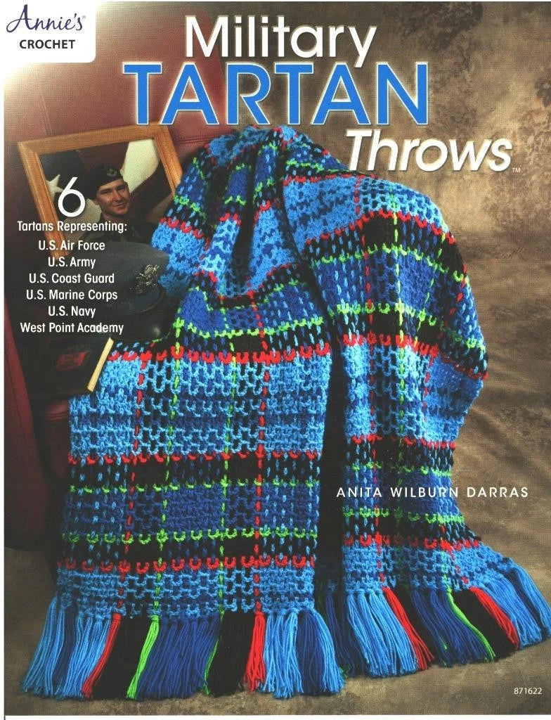 Crocheted military tartan throw with colorful pattern on a textured background