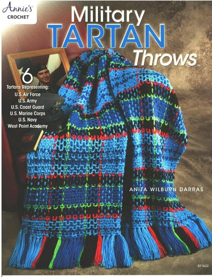 Crocheted military tartan throw with colorful pattern on a textured background