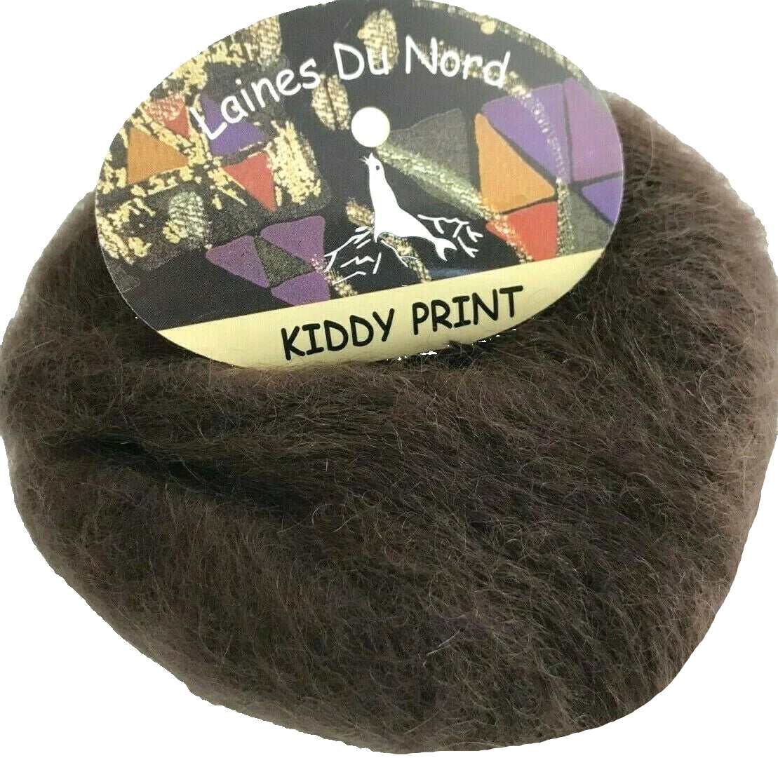 Ball of brown yarn with a colorful label reading 'Laines Du Nord Kiddy Print'.