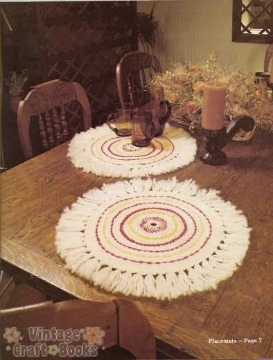 Two crocheted placemats on a wooden table with a vintage feel.