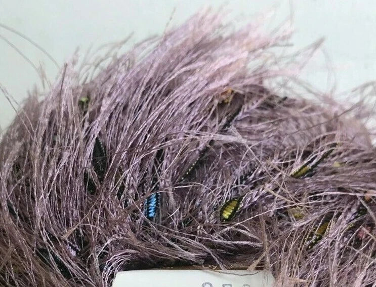 Close-up of purple synthetic hair with a label in the foreground