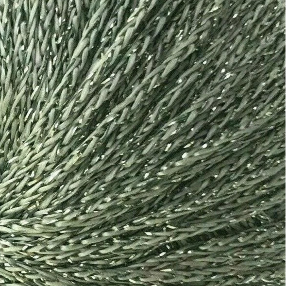 Close-up of green yarn with glittery texture