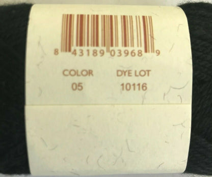 Yarn roll with a barcode label on a black background
