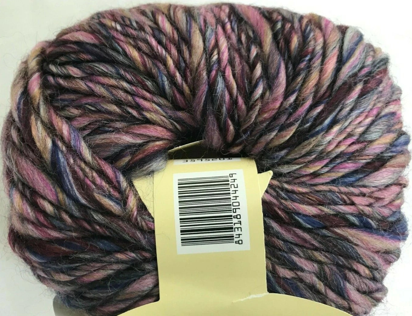 Multicolored skein of yarn with a label on a white background