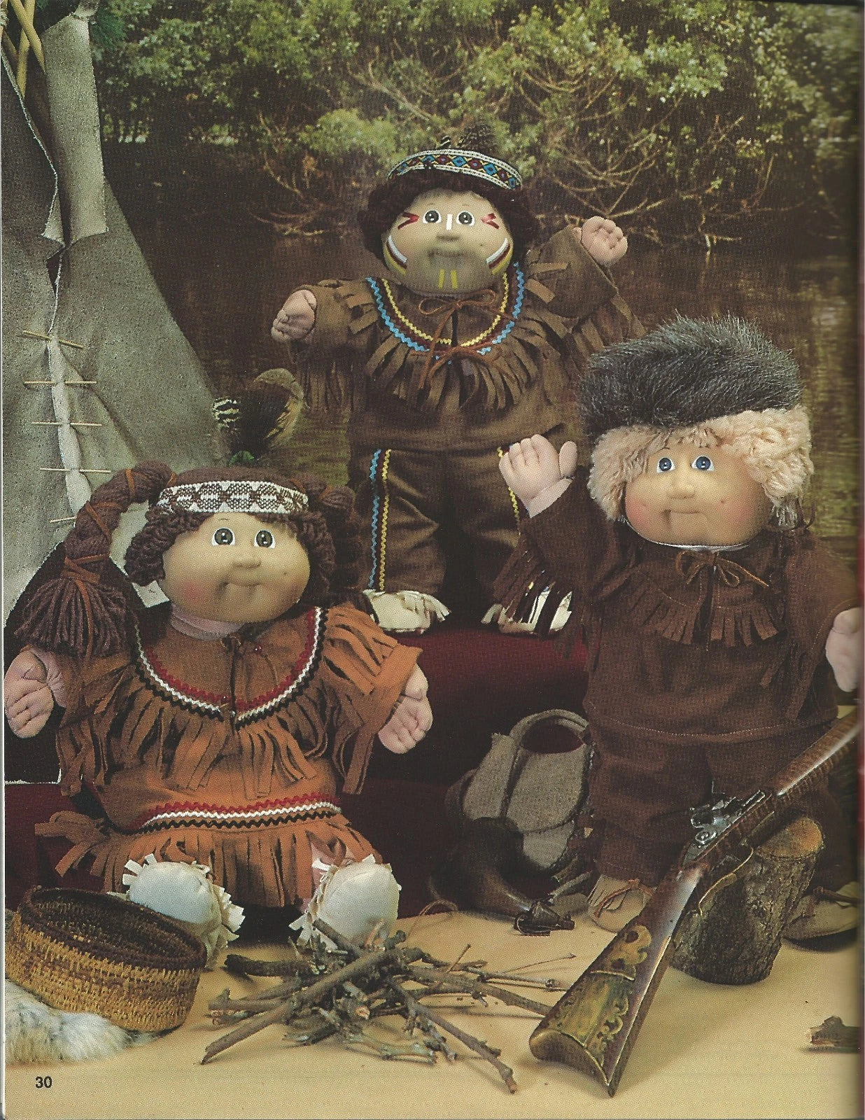 Three dolls in Native American attire with a rustic setting