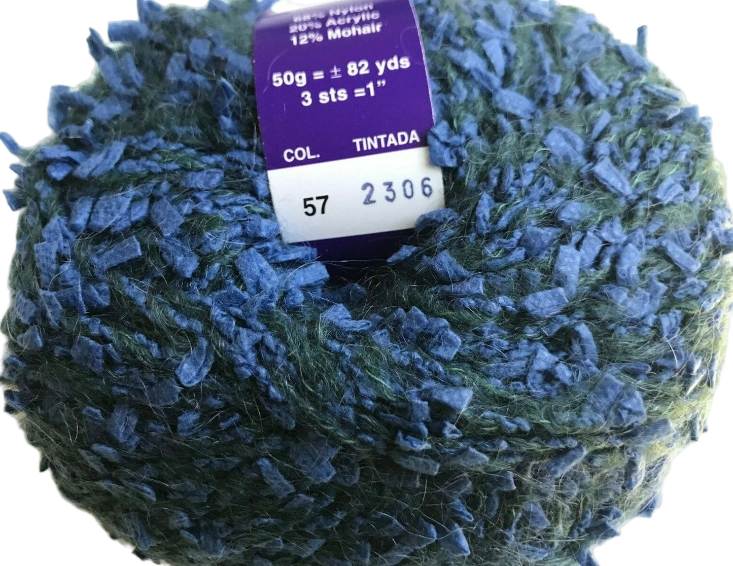 Ball of blue yarn with a label on a white background