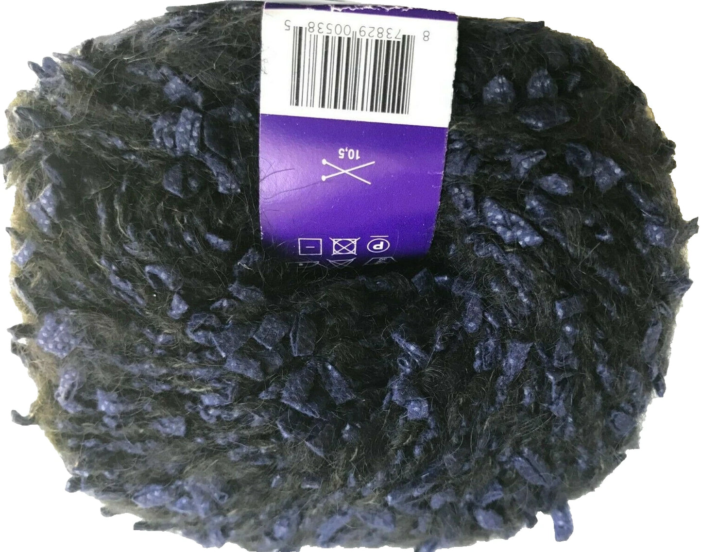 Ball of dark yarn with a purple label on a white background