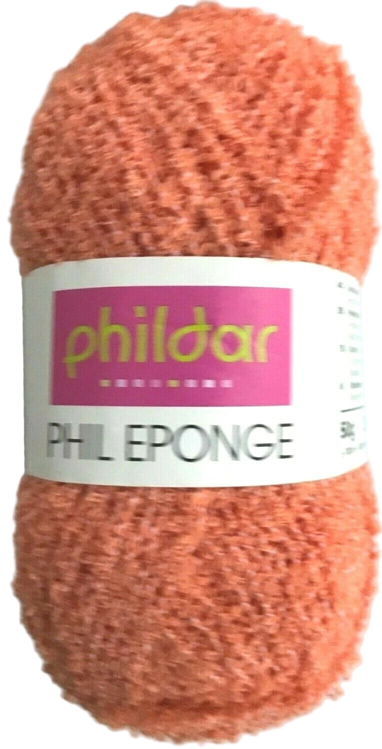 Ball of orange yarn with a 'phildar' label on a white background