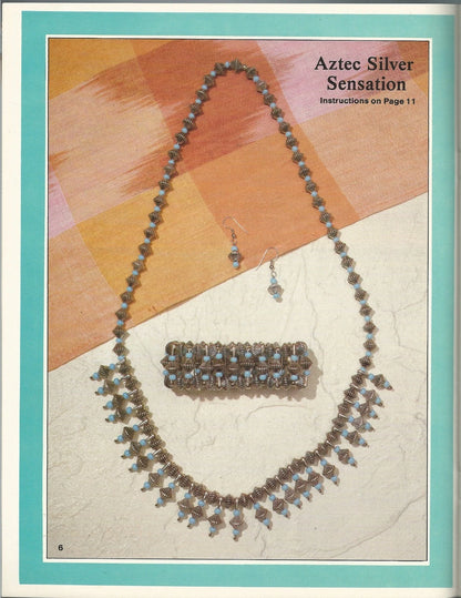 Jewelry set with necklace, bracelet, and earrings on a patterned background with text 'Aztec Silver Sensation'.