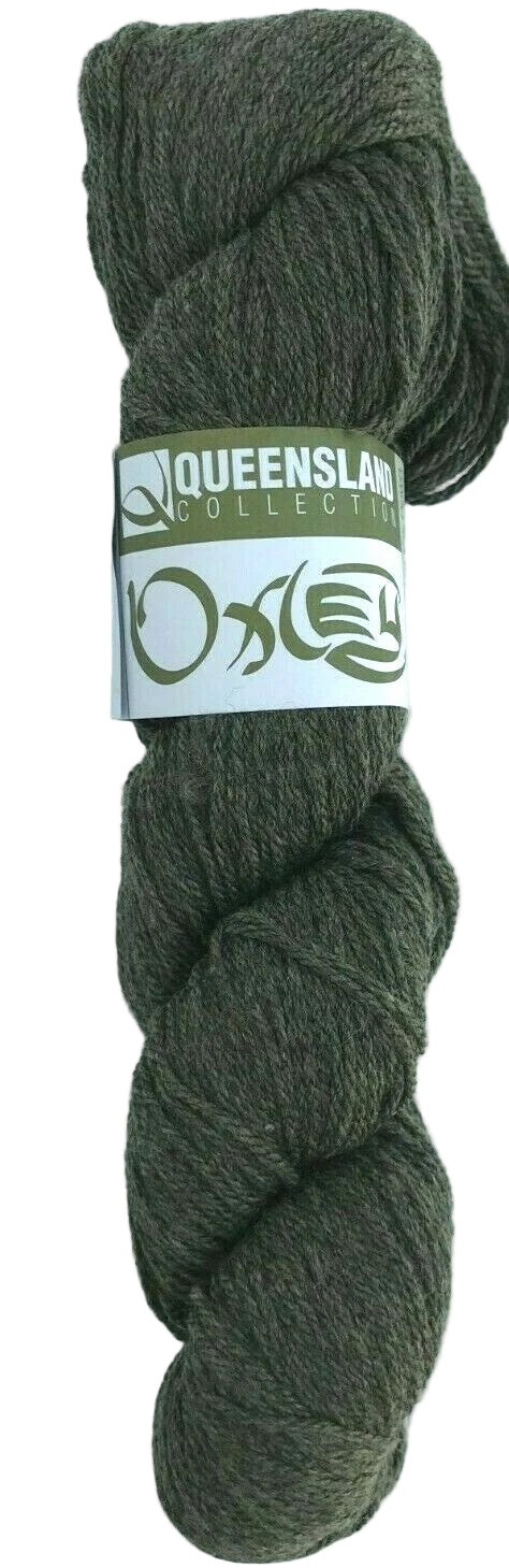 Ball of green yarn with a label on a white background
