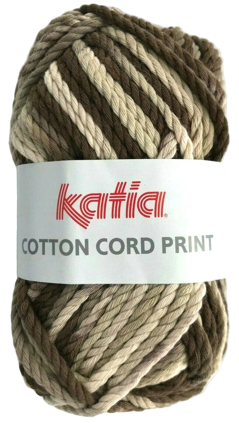 Ball of Katia Cotton Cord Print yarn with a label on a white background
