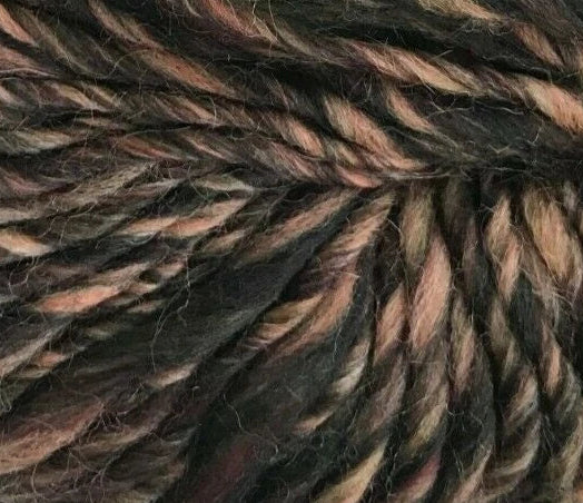 Close-up of a skein of dark brown yarn with subtle color variations.