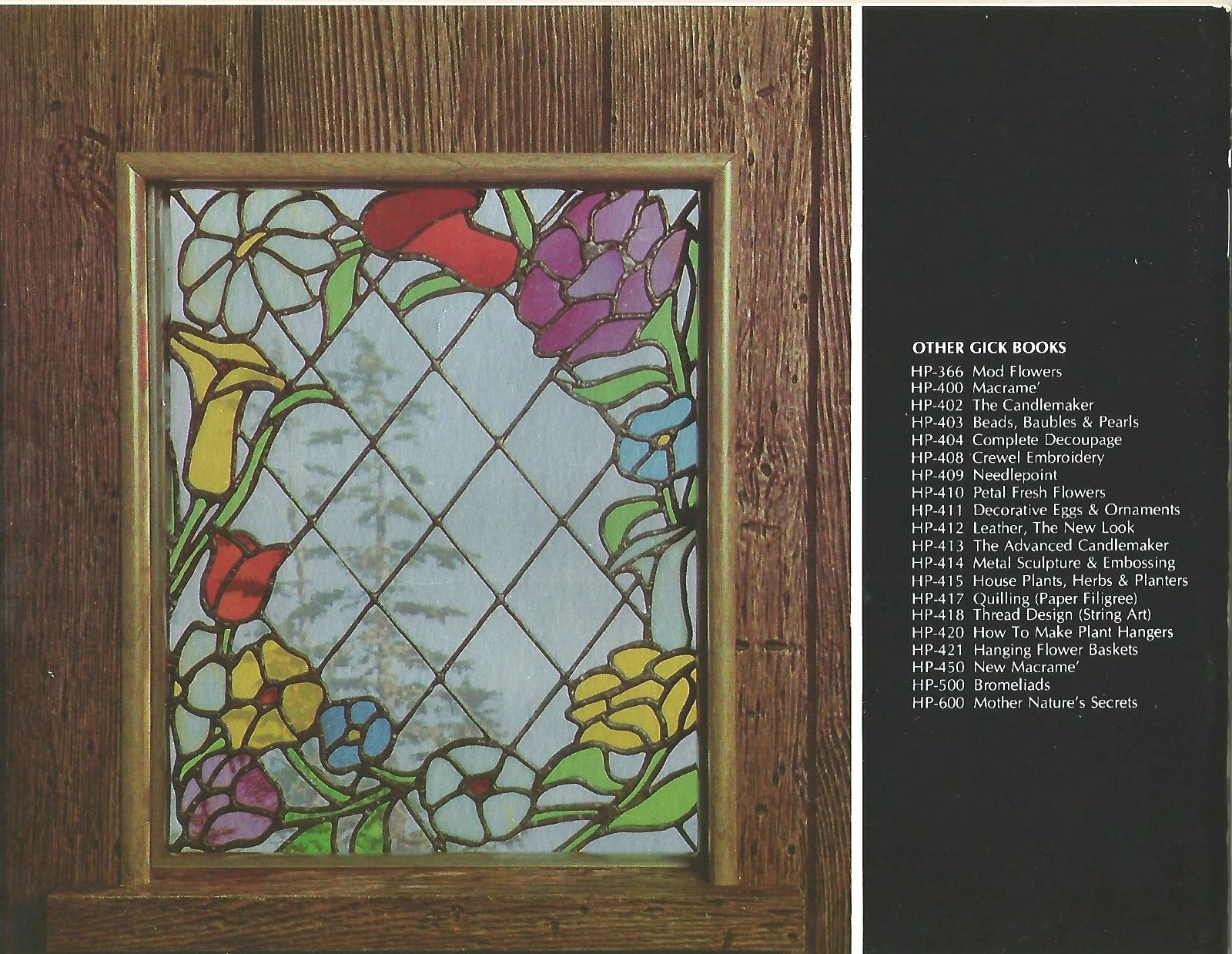 Stained glass panel with floral design on a wooden frame, next to a list of other craft books.