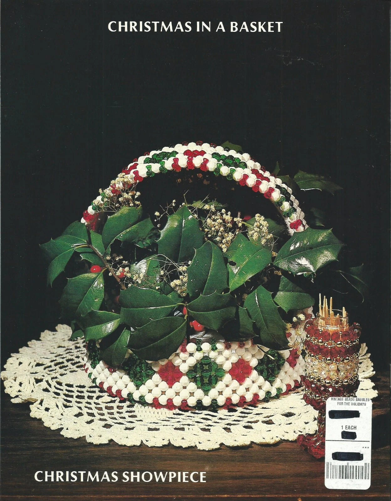 Decorative Christmas basket with holly leaves and berries on a dark background