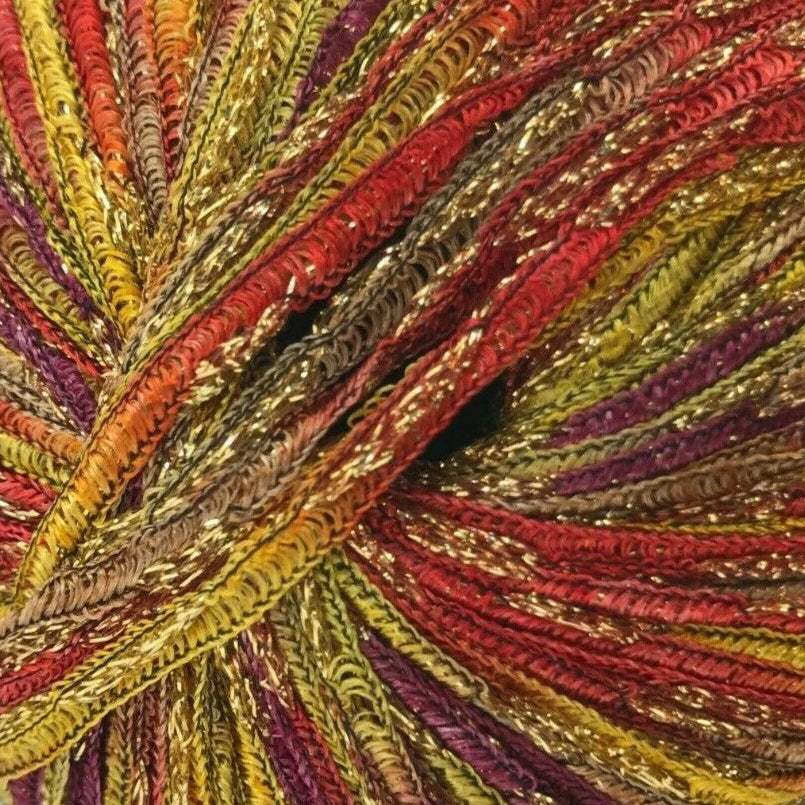 Multicolored yarn ball with red, yellow, and gold tones on a white background