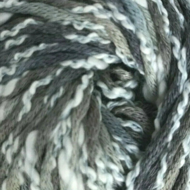 Ball of gray and white yarn on a white background