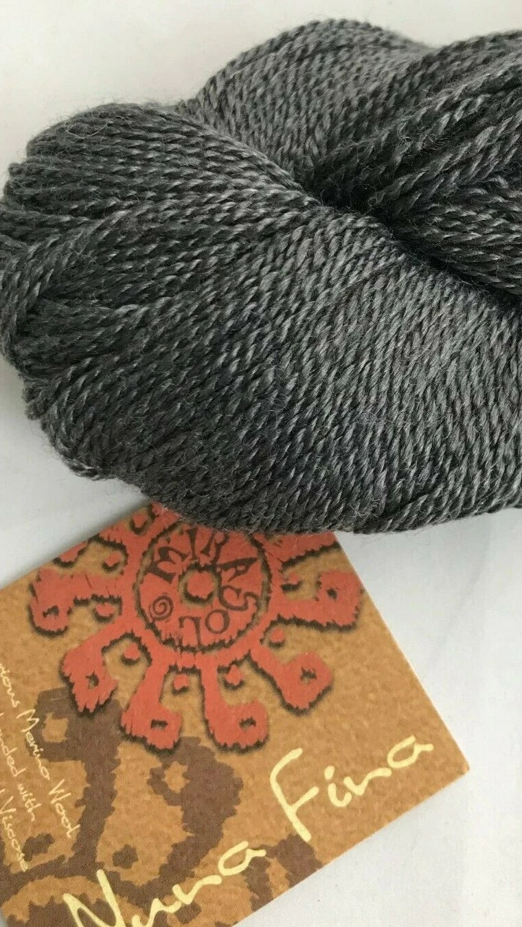 Gray skein of yarn with a label on a white background