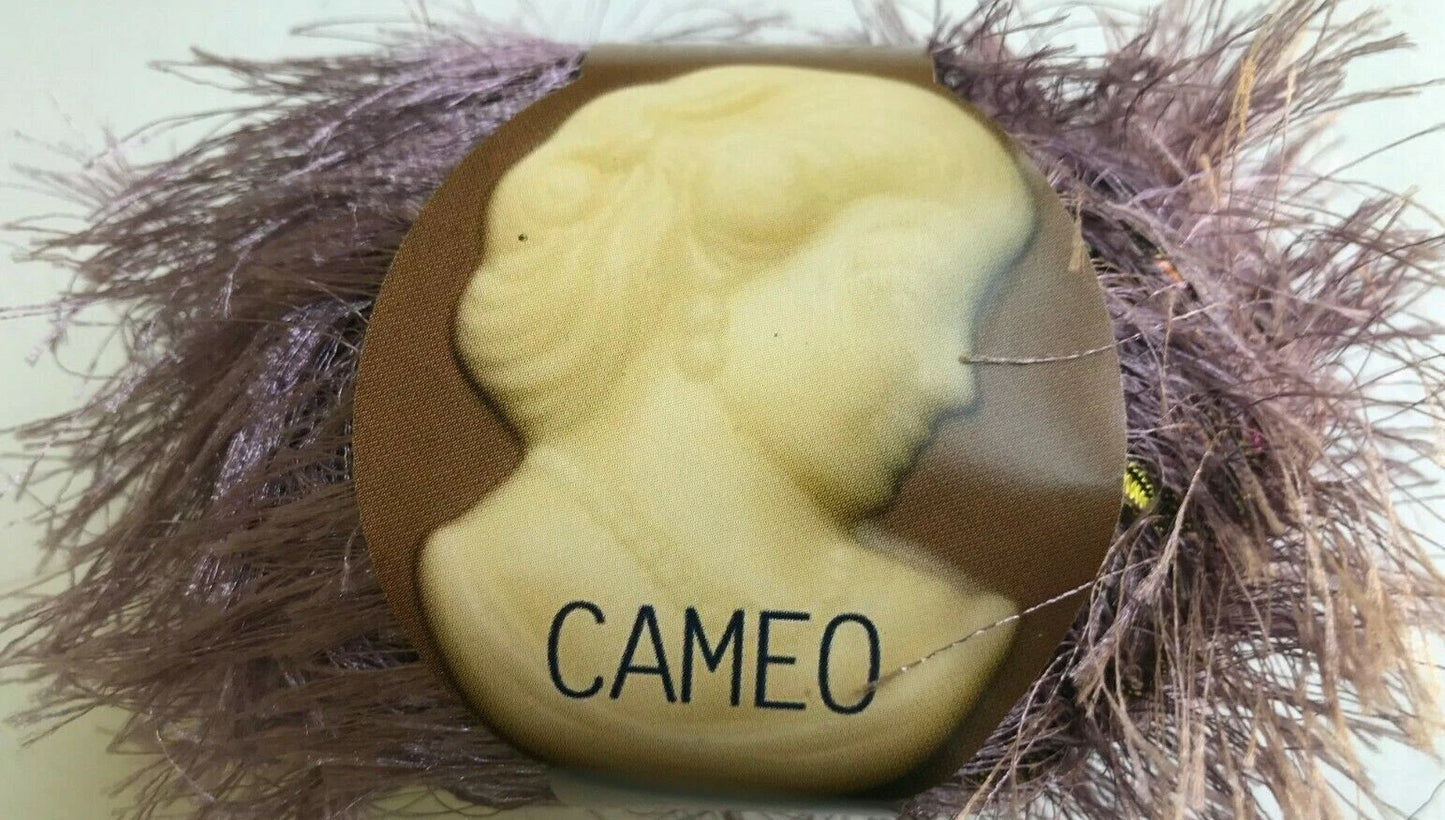 Cameo stone with 'CAMEO' text on a bed of straw