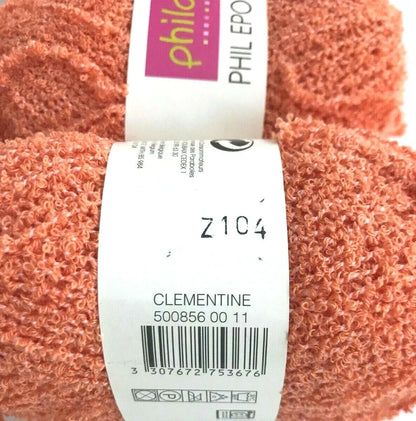 Ball of yarn with a label showing brand and product details