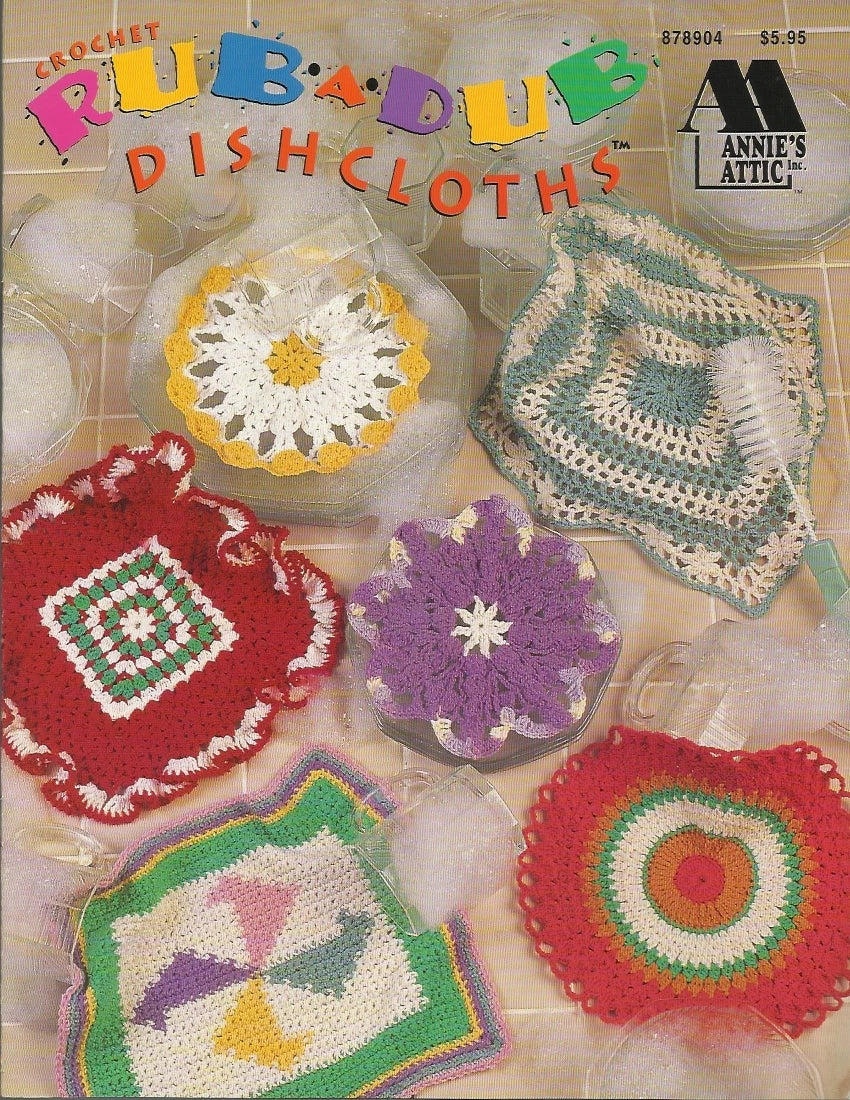 Vintage crochet dishcloth pattern book cover with colorful dishcloths and 'Annie's Attic' branding.