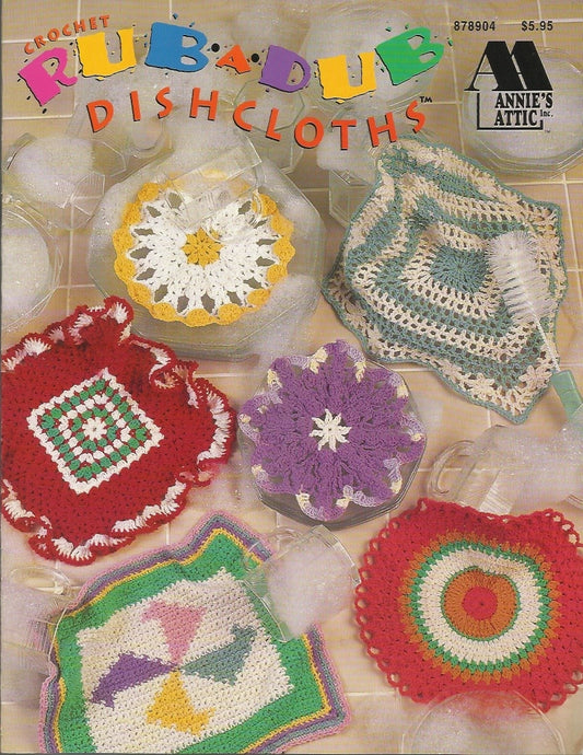 Vintage crochet dishcloth pattern book cover with colorful dishcloths and 'Annie's Attic' branding.