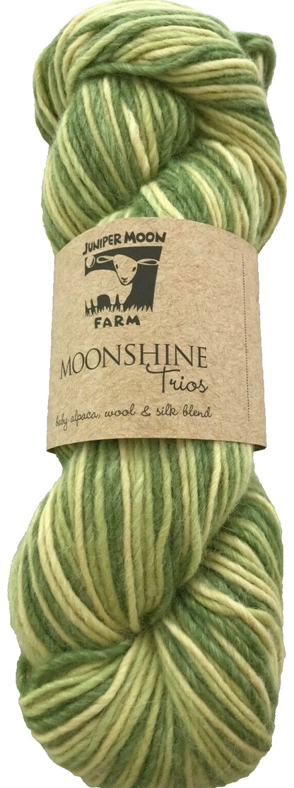 Green and white skein of yarn with a label on a white background