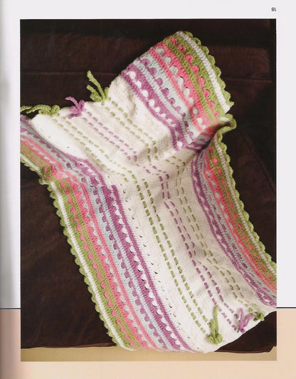 Knitted scarf with colorful pattern on a dark surface