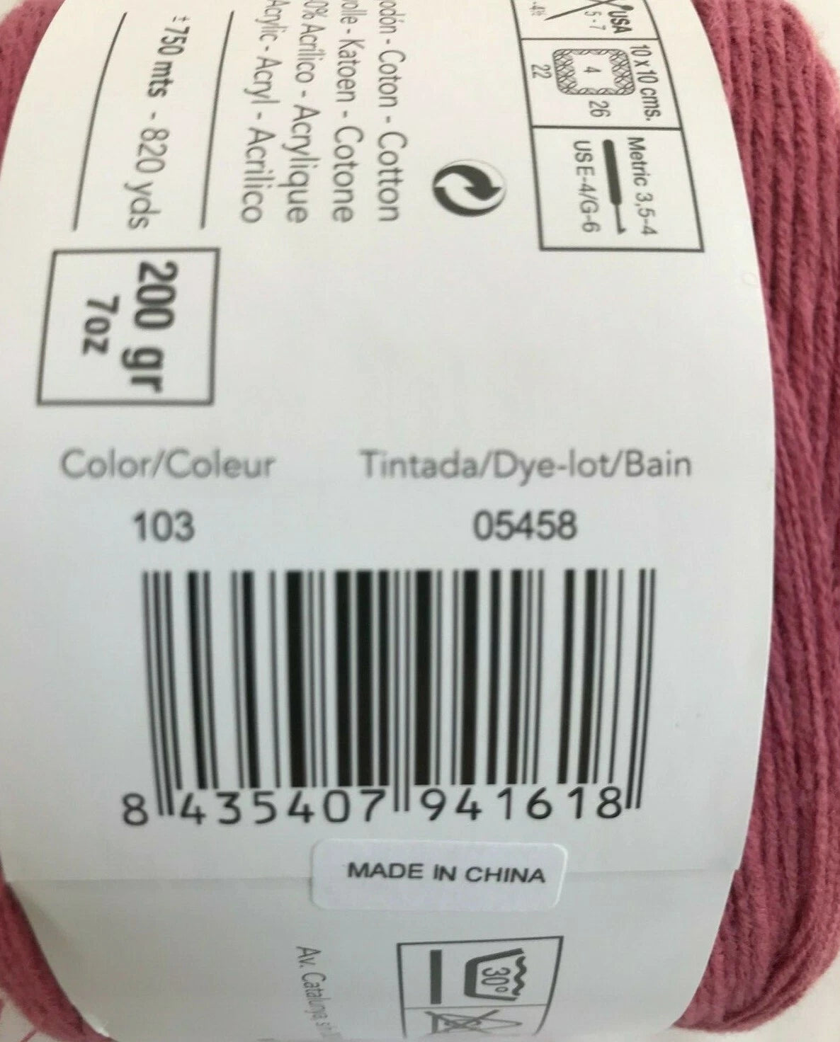 Yarn ball with label showing product details and barcode