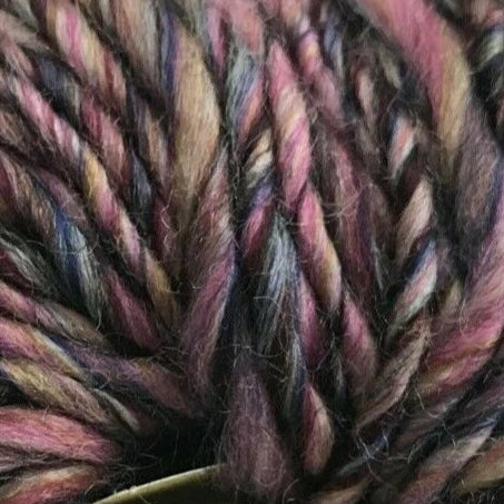 Close-up of multicolored yarn with a knitting needle.