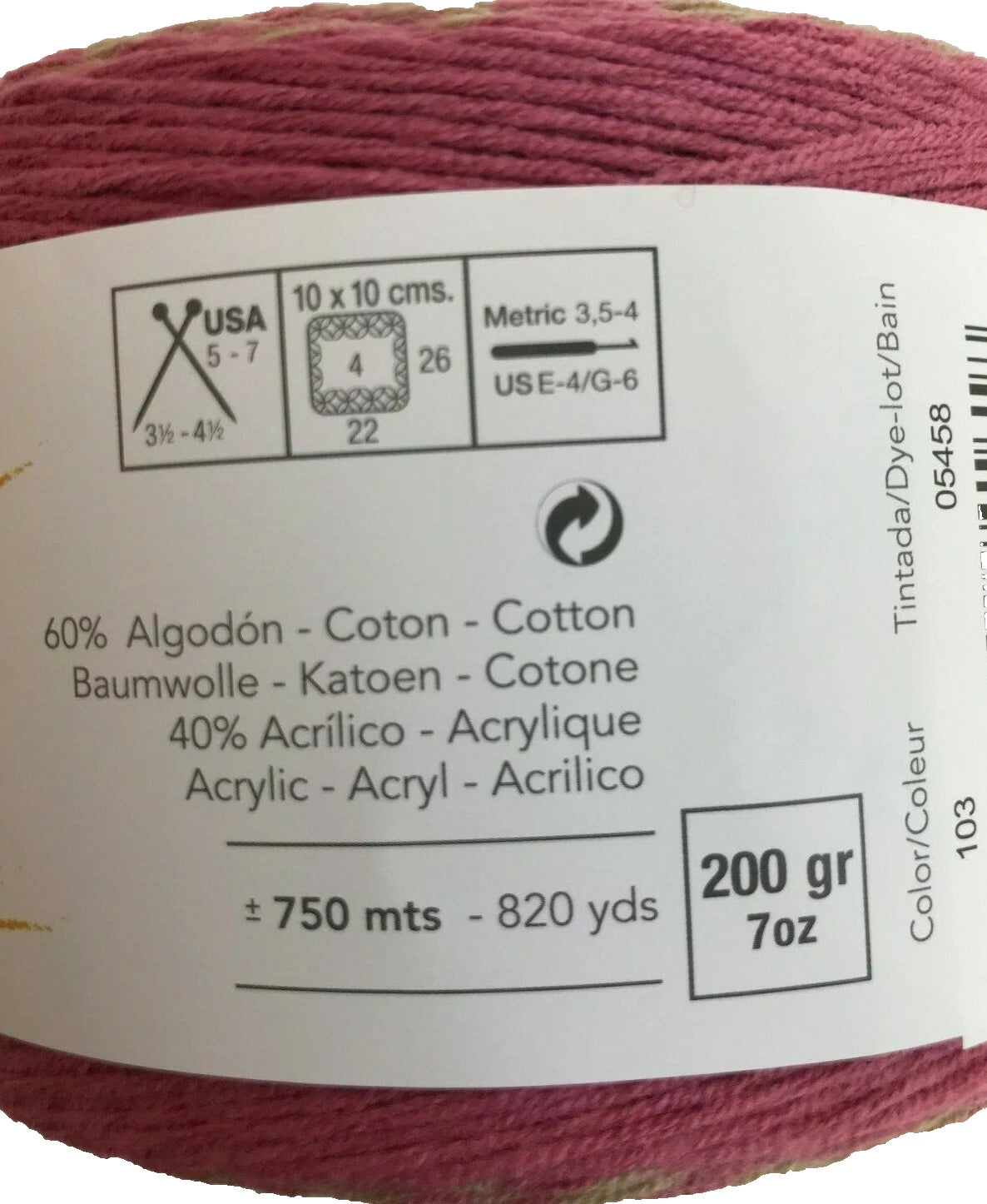 Close-up of a ball of yarn with label details on a white background