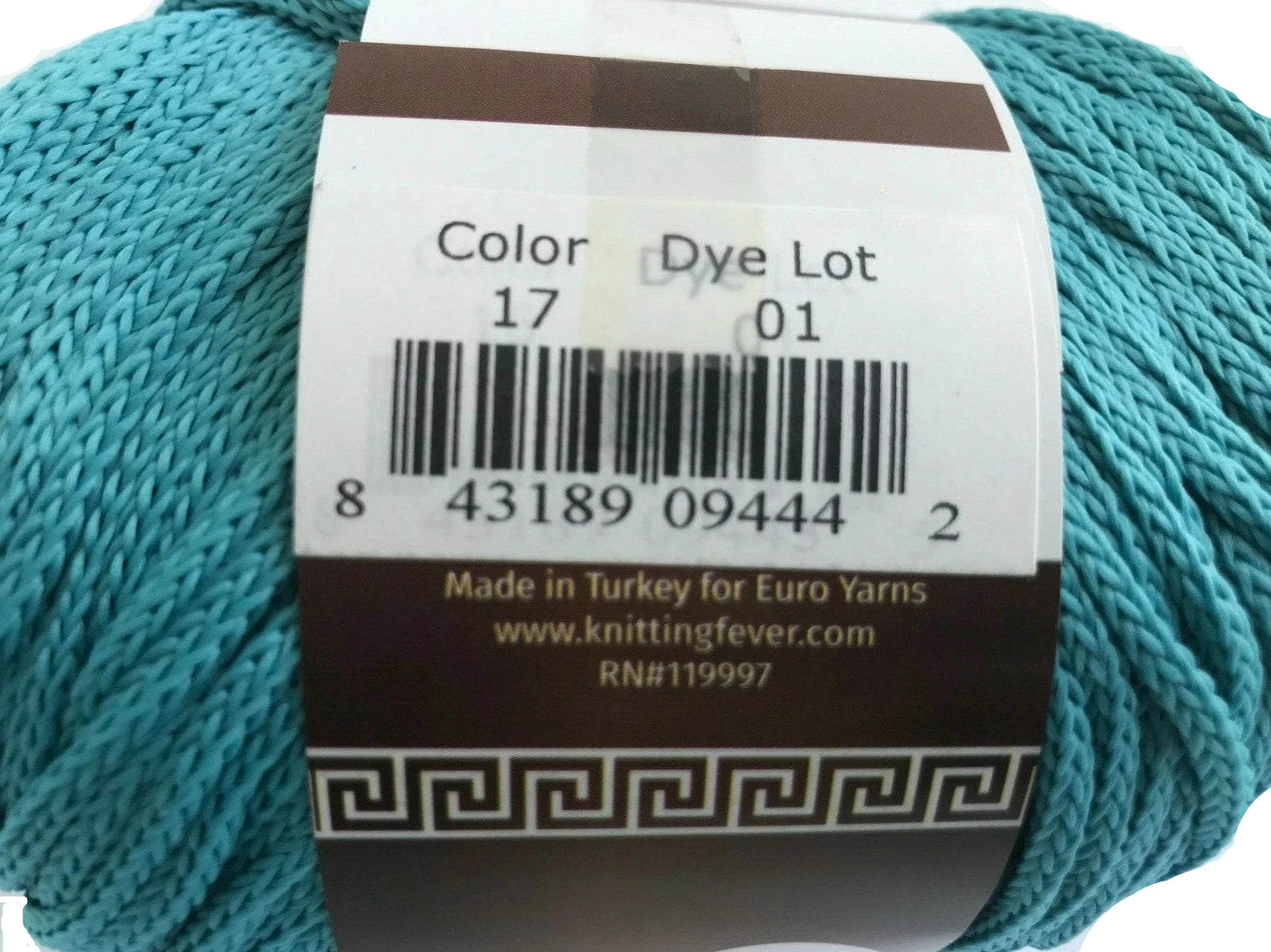 Turquoise yarn with a label showing product details