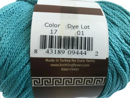 Turquoise yarn with a label showing product details