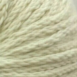 Close-up of a ball of cream-colored yarn