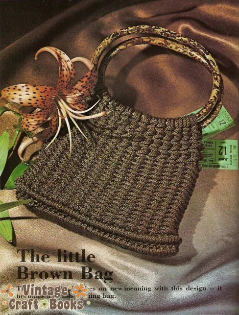 Brown crochet bag with a flower on a brown fabric background, featuring 'Vintage Craft Books' text.