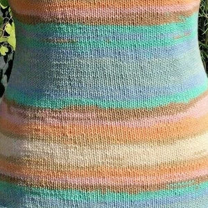 Close-up of a colorful striped sock with a blurred background