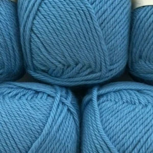 Close-up of blue yarn balls with a focus on texture and color.