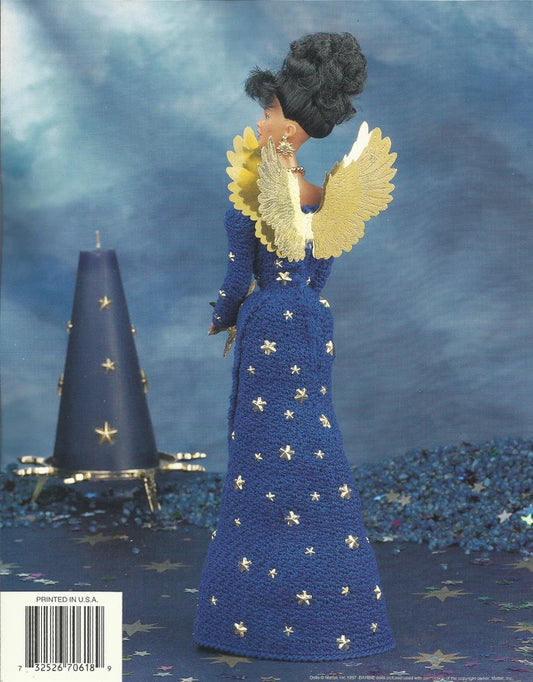 Decorative angel figurine with blue dress and yellow wings against a starry night sky.