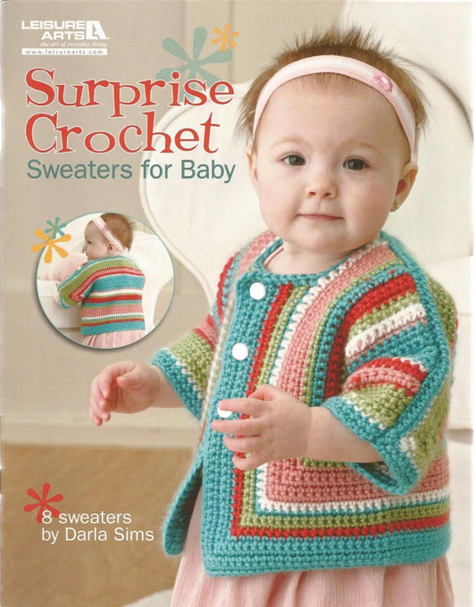 Book cover of 'Surprise Crochet Sweaters for Baby' by Leisure Arts with a baby wearing a colorful crochet sweater.