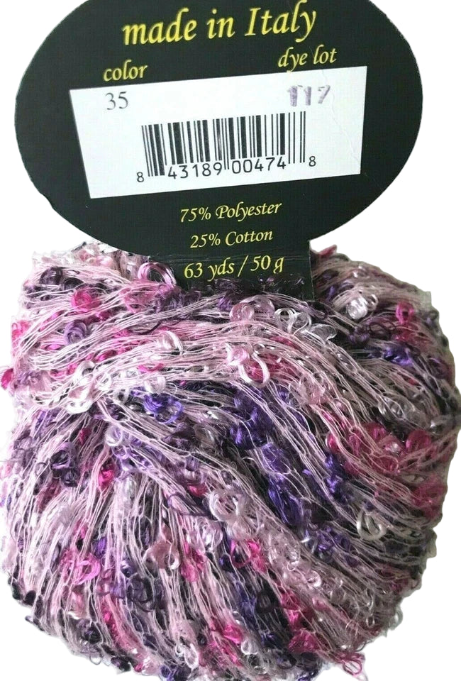 Multicolored yarn ball with a label indicating 'made in Italy' and fiber content.